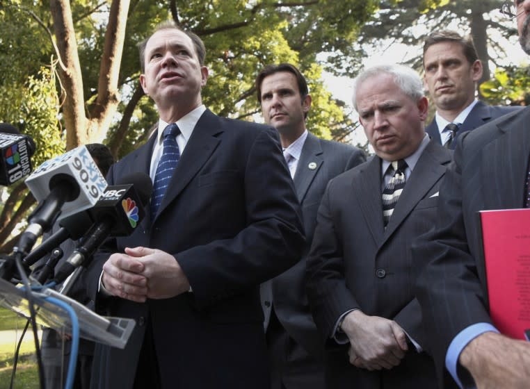 Jon Coupal, of the Howard Jarvis Taxpayers Association, left, answers questions concerning the lawsuit his group and others are filing to block the implementation of a Democratic budget package, at a news conference in Sacramento, Calif., Tuesday, Jan. 6, 2009. The suit, filed Tuesday in the Third District Court of Appeals, claims the state Legislature ignored the two-thirds requirement to pass taxes in approving by simple majority an $18 billion Democratic budget package. Joining Coupal were Assemblyman Cameron Smyth, R-Santa Clarita, second from left, Dr. John Eastman, dean of the Chapman University School of Law, second from right, and state Sen. Tony Strickland, R-Thousand Oaks, right. (AP Photo/Rich Pedroncelli) ** Usable by LA and DC Only **