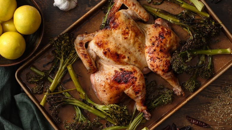 A whole roasted chicken and broccolini