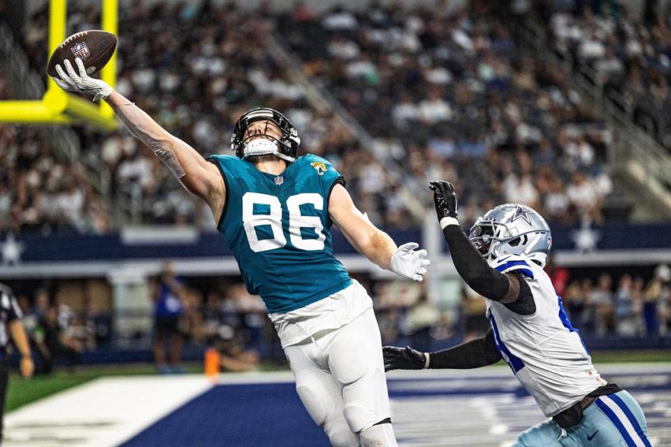 Jacksonville Jaguars tight end Gerrit Prince (86) reaches for the ball with one hand in the end zone in the third quarter during the first preseason game between the Dallas Cowboys and Jacksonville Jaguars at AT&T Stadium in Arlington, Texas on Saturday, Aug. 12, 2023. Chris Torres/ctorres@star-telegram.com