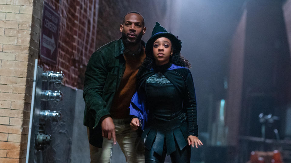 Marlon Wayans and Priah Ferguson play a father and daughter fighting off enchanted Halloween decorations in The Curse of Bridge Hollow. (Netflix)