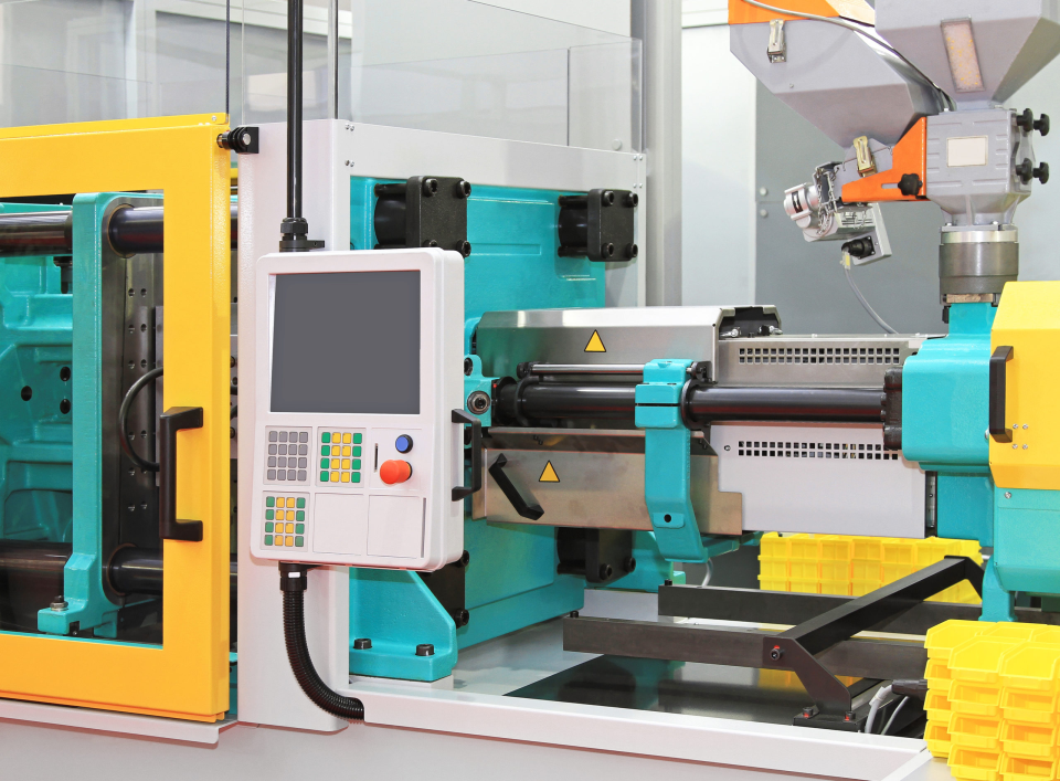 Industrial Molding Corporation (“IMC”) Injection Molding Machine