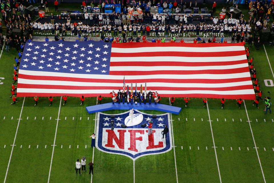 The NFL and NFLPA released a statement on Thursday night announcing that both sides are actively working together to find a “resolution to the anthem issue,” and that the NFL won’t enforce the current policy while the NFL and NFLPA engage in talks. (Getty Images)