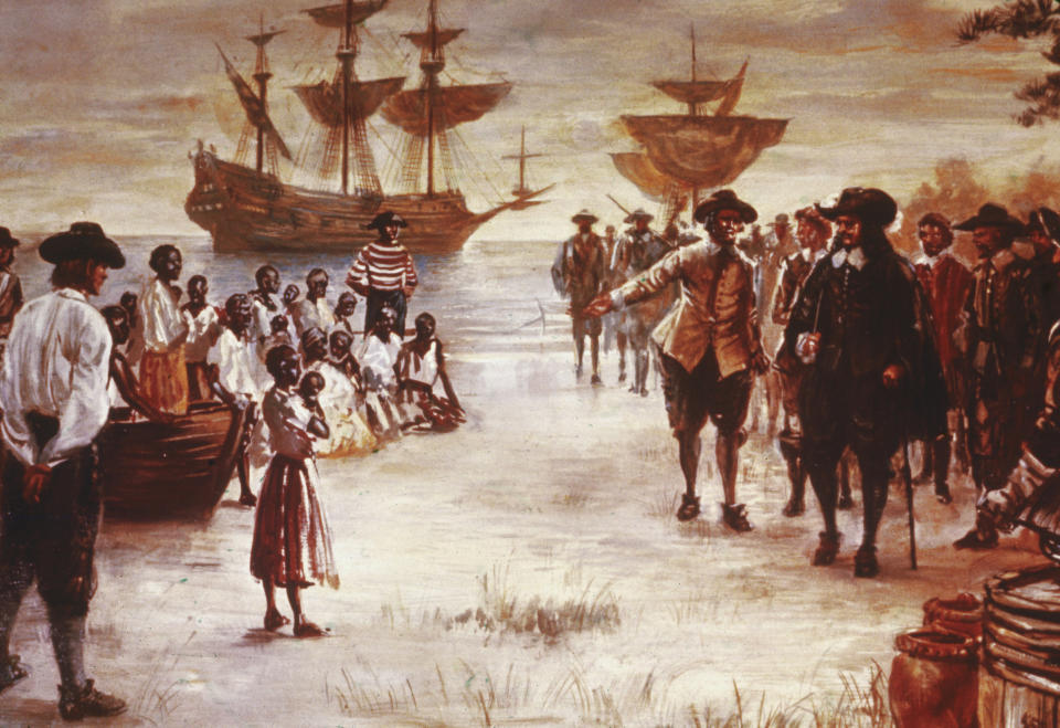 An engraving shows the arrival of a Dutch slave ship with a group of enslaved Africans for sale, Jamestown, Va., 1619. | Getty Images—2004 Getty Images