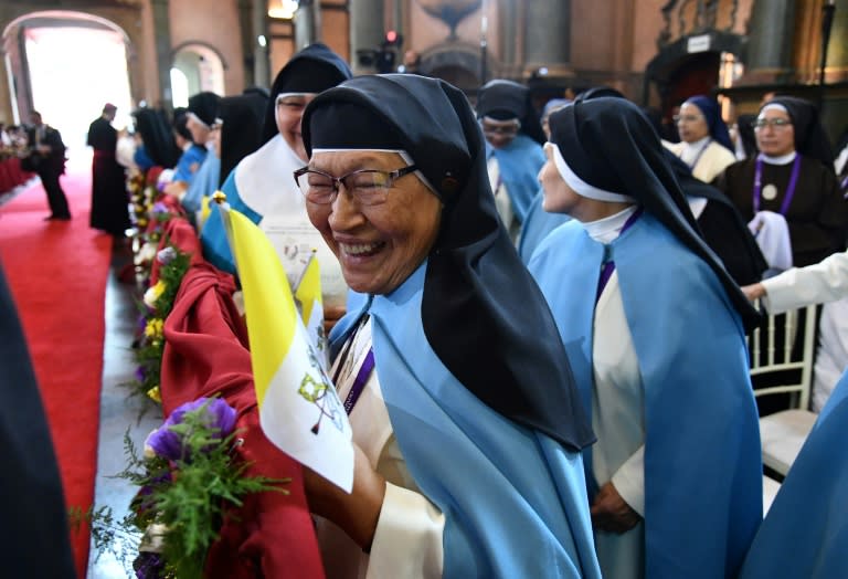 Nuns await for the arrival of Pope Francis inside the Senor de los Milagros Sanctuary, in Lima on January 21, 2018, before the pontiff held mass with a million faithful at the end of his tour to Peru and Chile