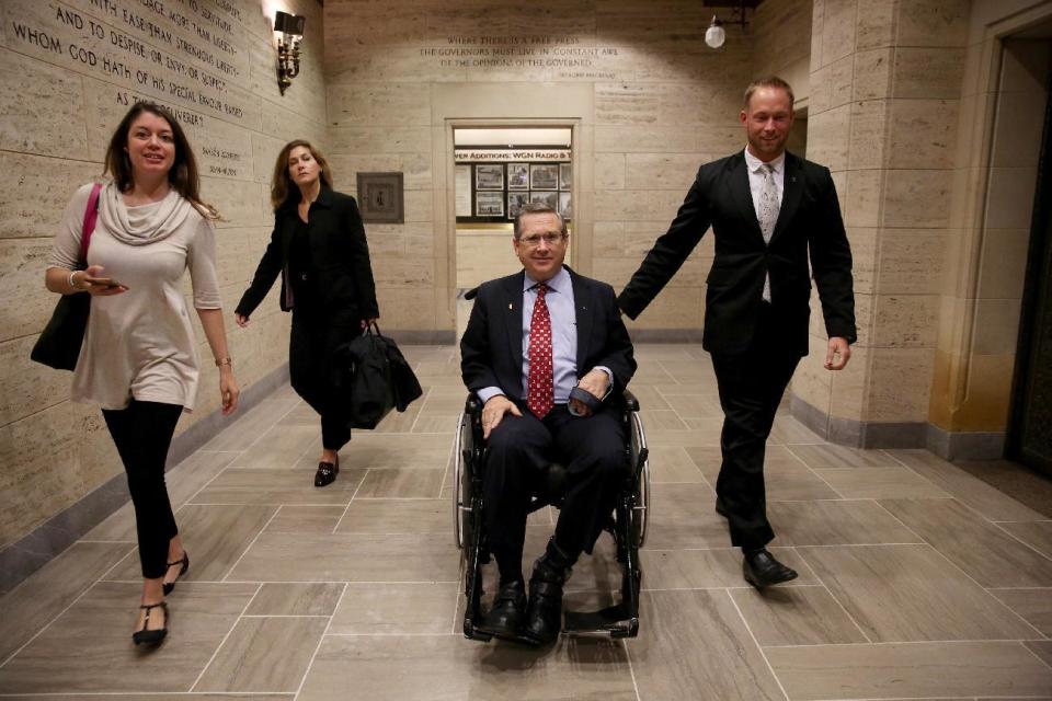 Republican Sen. Mark Kirk leaves the Chicago Tribune Tower after meeting with the editorial board. He and Democratic Senate candidate Tammy Duckworth debated Oct. 3 at the newspaper's offices. (Photo: Nancy Stone/Chicago Tribune via AP)