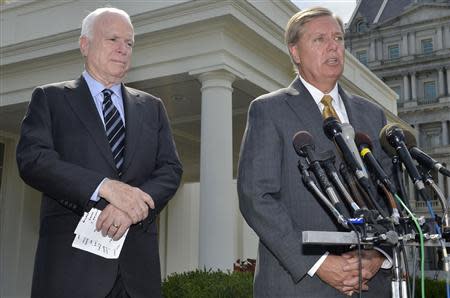 U.S. Senator Lindsey Graham (R-SC), (R), makes remarks to the media as U.S. Senator John McCain (R-AZ), (L), listens, after meeting with U.S. President Barack Obama at the White House, on possible military action against Syria, in Washington September 2, 2013. REUTERS/Mike Theiler