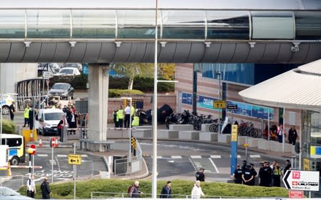 Police officers are seen as a suspect package was found at Manchester Airport