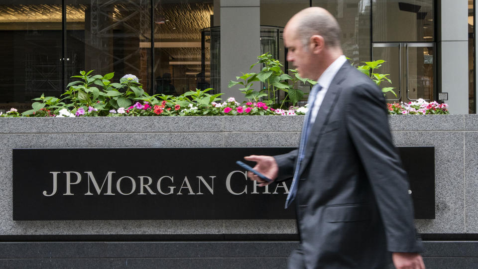 NEW YORK - NEW YORK - JUNE 12 : A man walks outside the JPMorgan Chase & Co. Headquarters on June 12, 2023. in New York. JP Morgan Chase stated that it planned to settle to pay $290 million to survivors of the deceased pedophile financier, Jeffrey Epstein, However, JP Morgan Chase will not admit liability despite the important settlement..  (Photo by Eduardo Munoz Alvarez/VIEWpress)