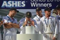 England's Kevin Pietersen takes a photograph of the Ashes Urn