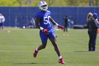 Buffalo Bills defensive end Greg Rousseau (50) runs a drill during an NFL football rookie minicamp in Orchard Park, N.Y., Friday, May 14, 2021. (AP Photo/Jeffrey T. Barnes)