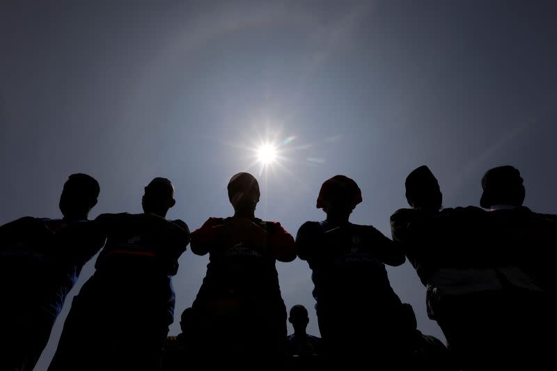 Muslim men perform mass prayers to mark the annular solar eclipse in Siak, Riau province