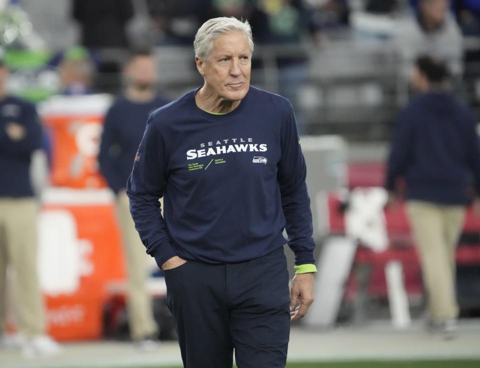 Seattle Seahawks head coach Pete Carroll watches his team warm up before playing against the Arizona Cardinals in Glendale on Jan. 7, 2024.