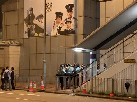 Riot police stand near a staircase during a demonstration in Hong Kong