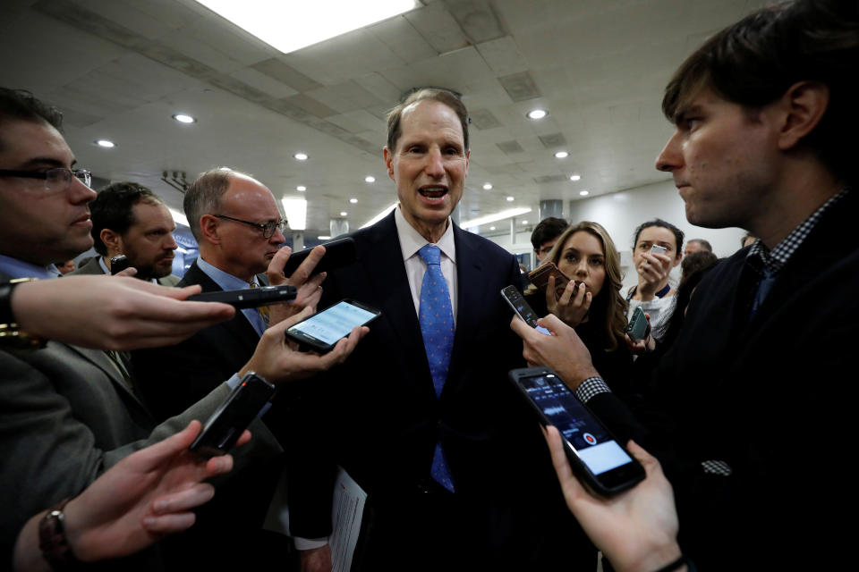 Senator Ron Wyden (D-OR) speaks with reporters ahead of the party luncheons on Capitol Hill in Washington, U.S. December 5, 2017. REUTERS/Aaron P. Bernstein