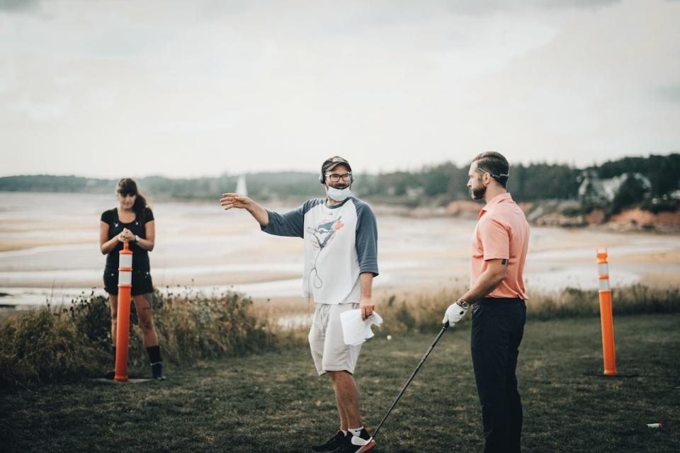 Jeremy Larter chats with Steve Lund, left, during the filming of Who's Yer Father last September. 