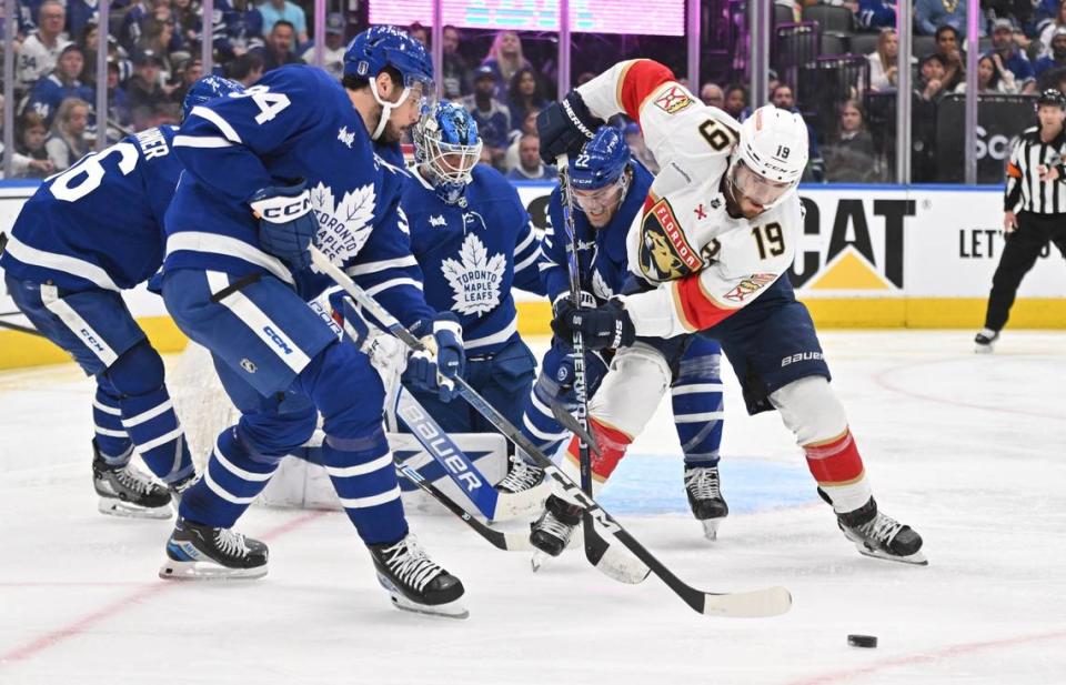 May 12, 2023; Toronto, Ontario, CAN; Florida Panthers forward Matthew Tkachuk (19) battles for a loose puck with Toronto Maple Leafs forward Auston Matthews (34) and defenseman Jake McCabe (22) in front of goalie Joseph Woll (60) in the second period in game five of the second round of the 2023 Stanley Cup Playoffs at Scotiabank Arena. Mandatory Credit: Dan Hamilton-USA TODAY Sports