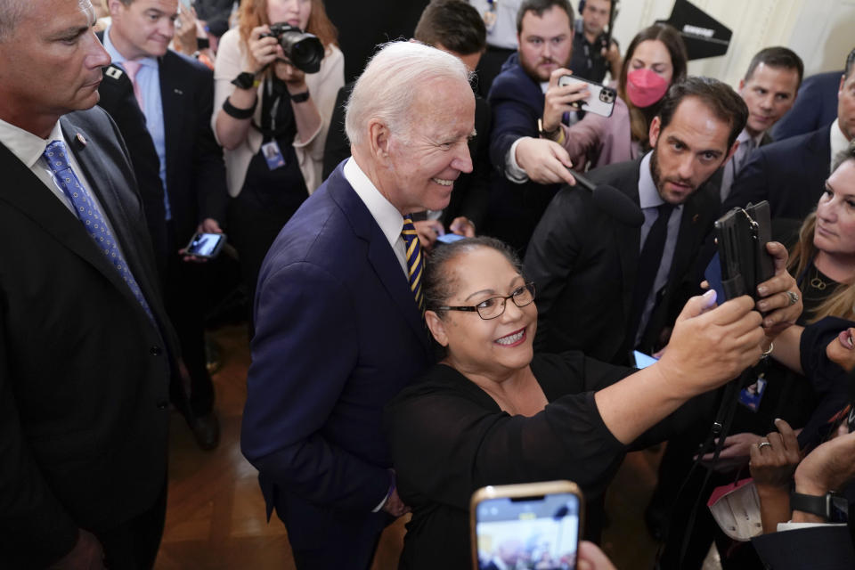 FILE - President Joe Biden poses for a photo as he leaves after signing the "PACT Act of 2022"during a ceremony in the East Room of the White House, Aug. 10, 2022, in Washington. (AP Photo/Evan Vucci, File)