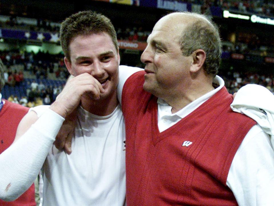Wisconsin quarterback Brooks Bollinger is hugged by head coach Barry Alvarez after their 31-28 overtime win against Colorado at the 2002 Alamo Bowl.