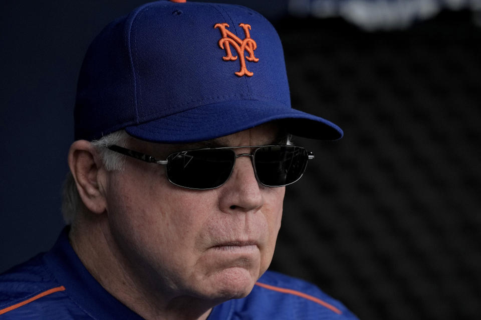 New York Mets manager Buck Showalter watches from the dugout before a baseball game against the Kansas City Royals Thursday, Aug. 3, 2023, in Kansas City, Mo. (AP Photo/Charlie Riedel)