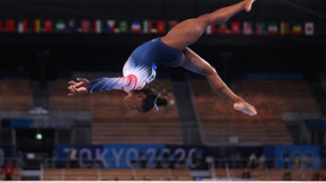 Simone Biles won a bronze medal on the balance beam, after withdrawing briefly from competition citing mental health concerns.   / Credit: CBS News