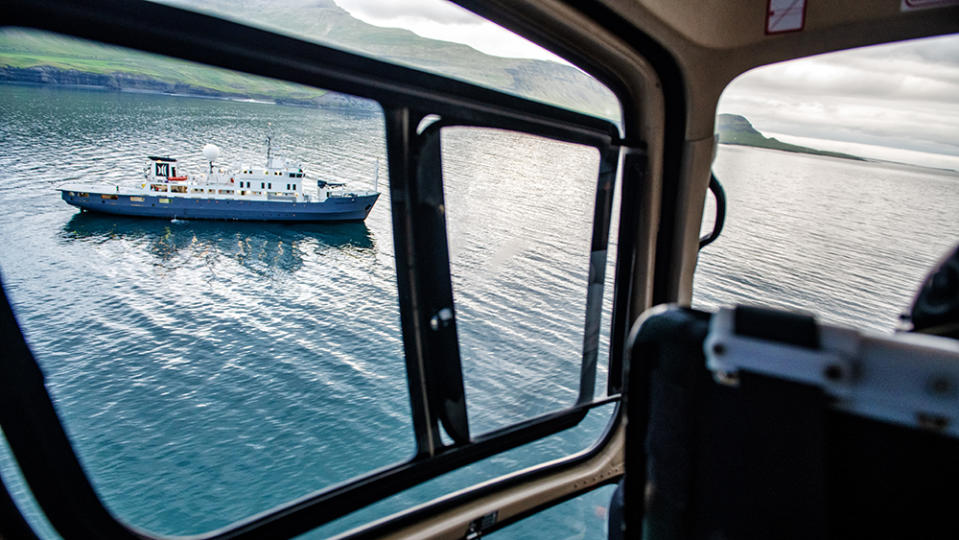 A helicopter trips over empty waters. - Credit: Christopher Scholey