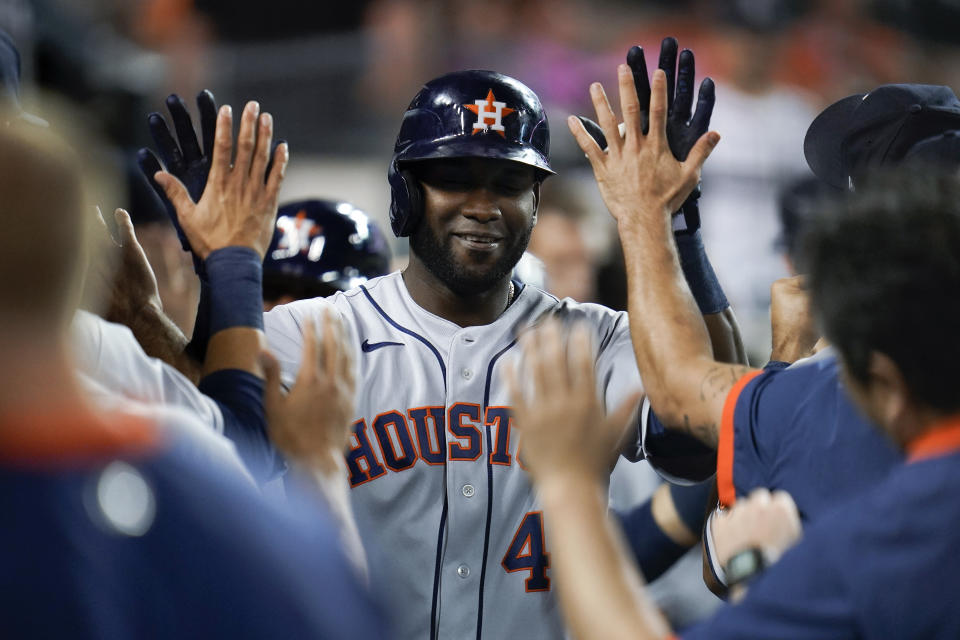 Houston Astros' Yordan Alvarez celebrates after hitting a grand slam in the ninth inning of a baseball game against the Detroit Tigers in Detroit, Thursday, June 24, 2021. (AP Photo/Paul Sancya)