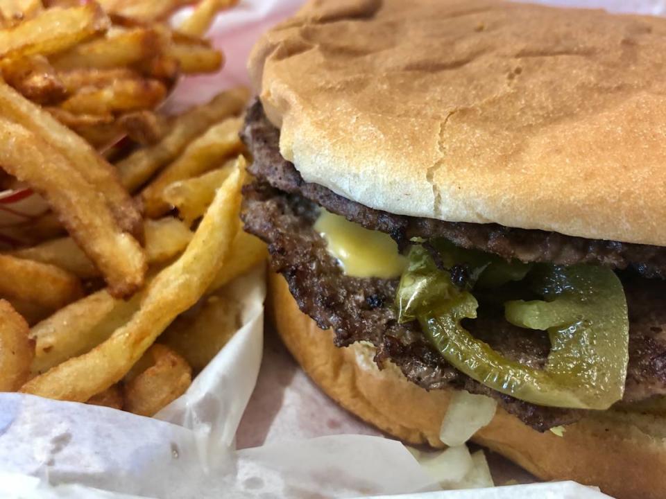 A Clown Burger jalapeno double cheeseburger with fries.