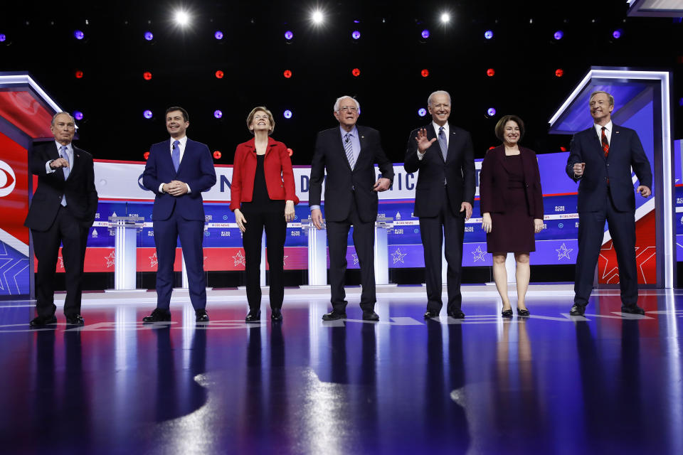 From left, Democratic presidential candidates, former New York City Mayor Mike Bloomberg, former South Bend Mayor Pete Buttigieg, Sen. Elizabeth Warren, D-Mass., Sen. Bernie Sanders, I-Vt., former Vice President Joe Biden, Sen. Amy Klobuchar, D-Minn., and businessman Tom Steyer stand on stage before a Democratic presidential primary debate, Tuesday, Feb. 25, 2020, in Charleston, S.C. (AP Photo/Matt Rourke)