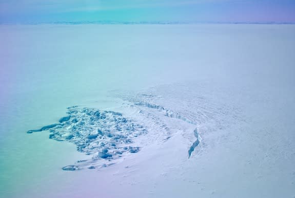 A surface crater in southwest Greenland that formed after a lake under the ice emptied and drained away.