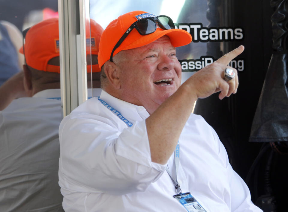 Car owner Chip Ganassi gestures in the paddock before an IndyCar race at Mid-Ohio Sports Car Course in Lexington, Ohio, Sunday, July 4, 2021. (AP Photo/Tom E. Puskar)