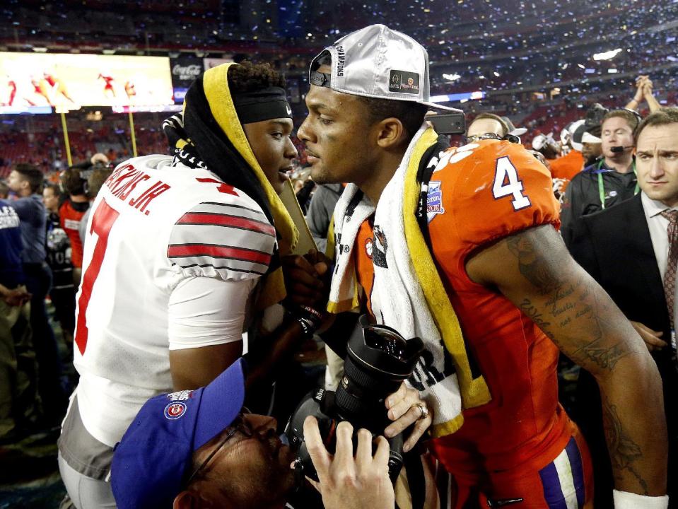 Clemson quarterback Deshaun Watson (4) greets Ohio State backup quarterback Dwayne Haskins after the Fiesta Bowl NCAA college football playoff semifinal, Saturday, Dec. 31, 2016, in Glendale, Ariz. Clemson won 31-0 to advance to the BCS championship game Jan. 9 against Alabama. (AP Photo/Ross D. Franklin)