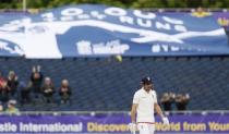 England's Alastair Cook celebrates reaching 10,000 test runs Action Images via Reuters / Jason Cairnduff