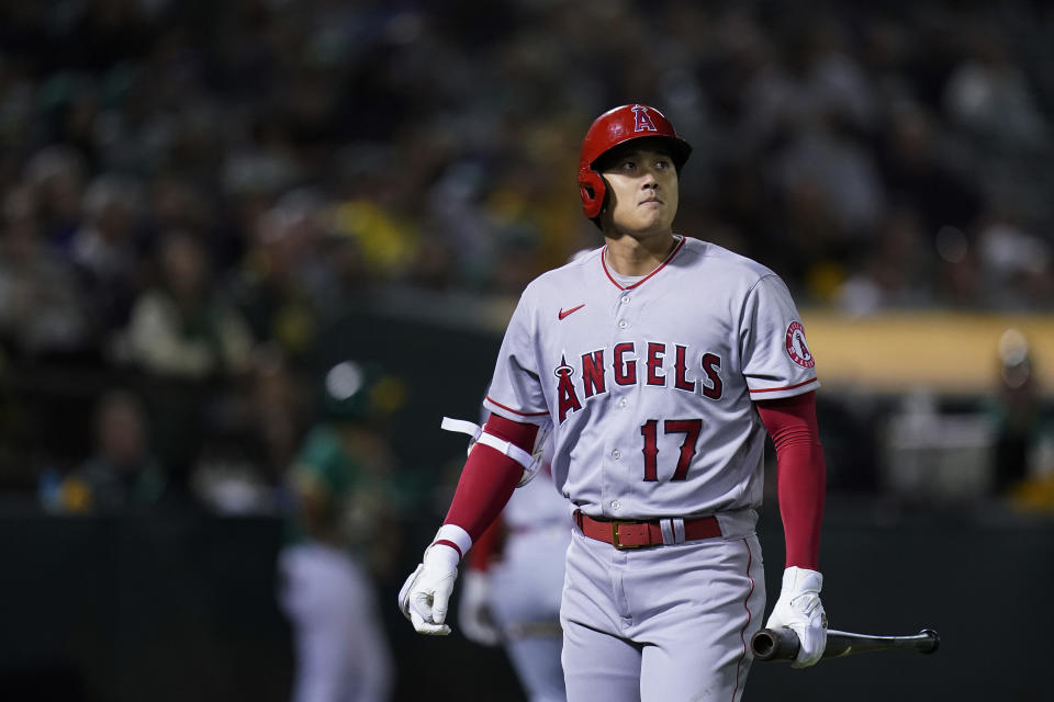 Los Angeles Angels'  Shohei Ohtani walks to the dugout after striking out against the Oakland Athletics during the eighth inning of a baseball game in Oakland, Calif., Tuesday, Oct.  4, 2022. (AP Photo/Godofredo A. Vásquez)