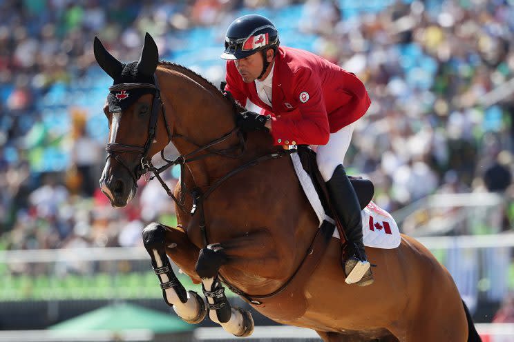 RIO DE JANEIRO, BRAZIL - AUGUST 14: Eric Lamaze of Canada Fine Lady 5 competes during the Jumping Individual and Team Qualifier on Day 9 of the Rio 2016 Olympic Games at the Olympic Equestrian Centre on August 14, 2016 in Rio de Janeiro, Brazil. (Photo by Christian Petersen/Getty Images)