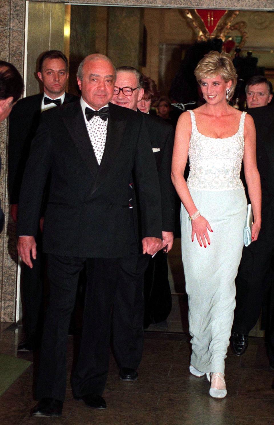 Princess Diana with Mohammed Al Fayed attending a charity dinner for the Harefield Heart Unit held at Harrods, London, February 1996. Diana wears a pale blue Catherine Walker dress. (Photo by Jayne Fincher/Getty Images)