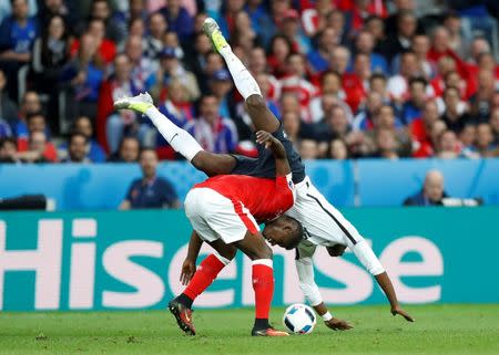 Football Soccer - Switzerland v France - EURO 2016 - Group A - Stade Pierre-Mauroy, Lille, France - 19/6/16France's Paul Pogba in action with Switzerland's Breel Embolo REUTERS/Carl RecineLivepic