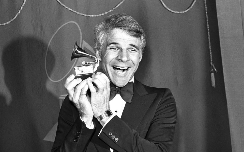 Steve Martin holds the Grammy Award which he won for Best Comedy Recording for the album "A Wild And Crazy Guy," in Los Angeles on Feb. 15, 1979