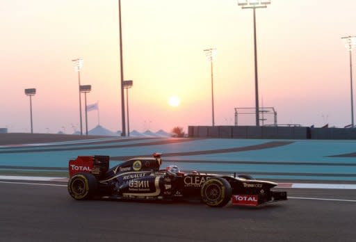 Kimi Raikkonen lived up to his 'ice man' sobriquet by claiming his first win for three years as Sebastian Vettel clung on to his championship lead in a drama-laden Abu Dhabi Grand Prix on Sunday