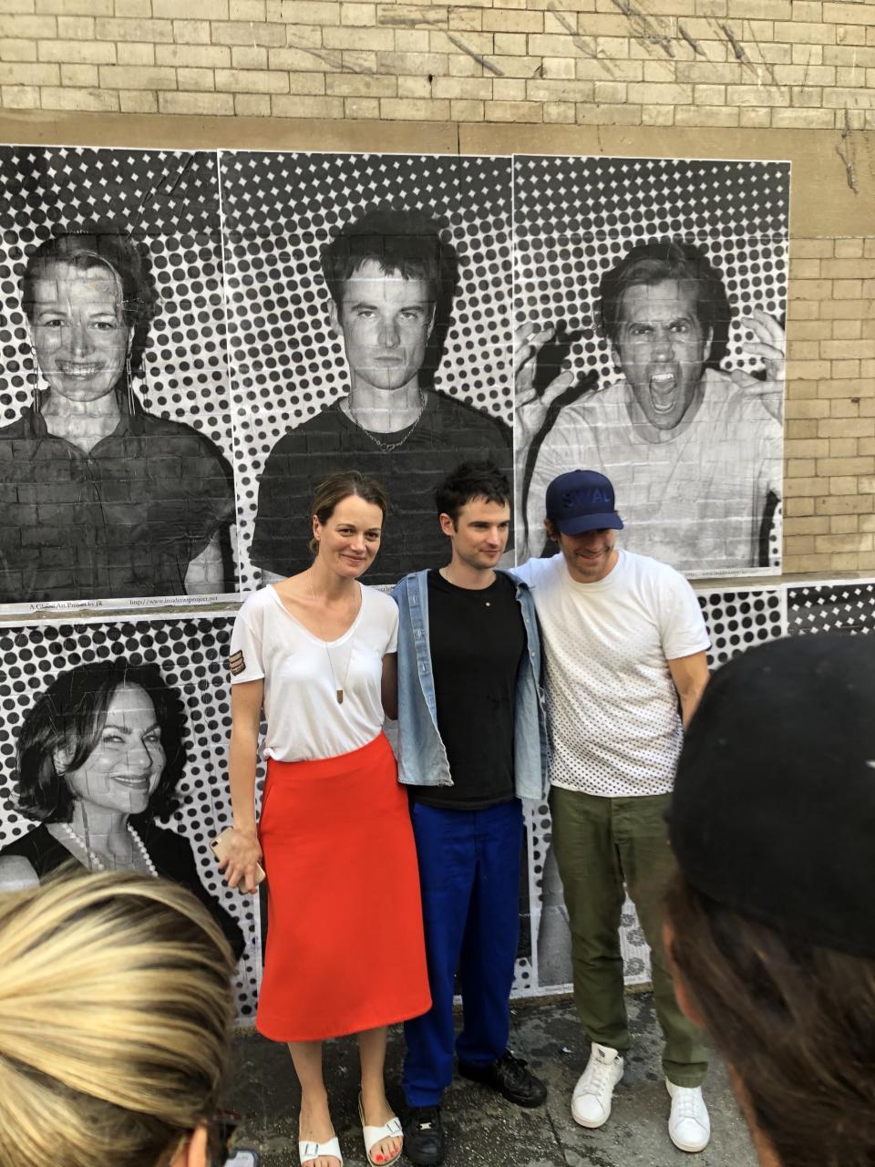 Sea Wall / A Life director Carrie Cracknell and stars Sturridge and Gyllenhaal posing in front of the mural.