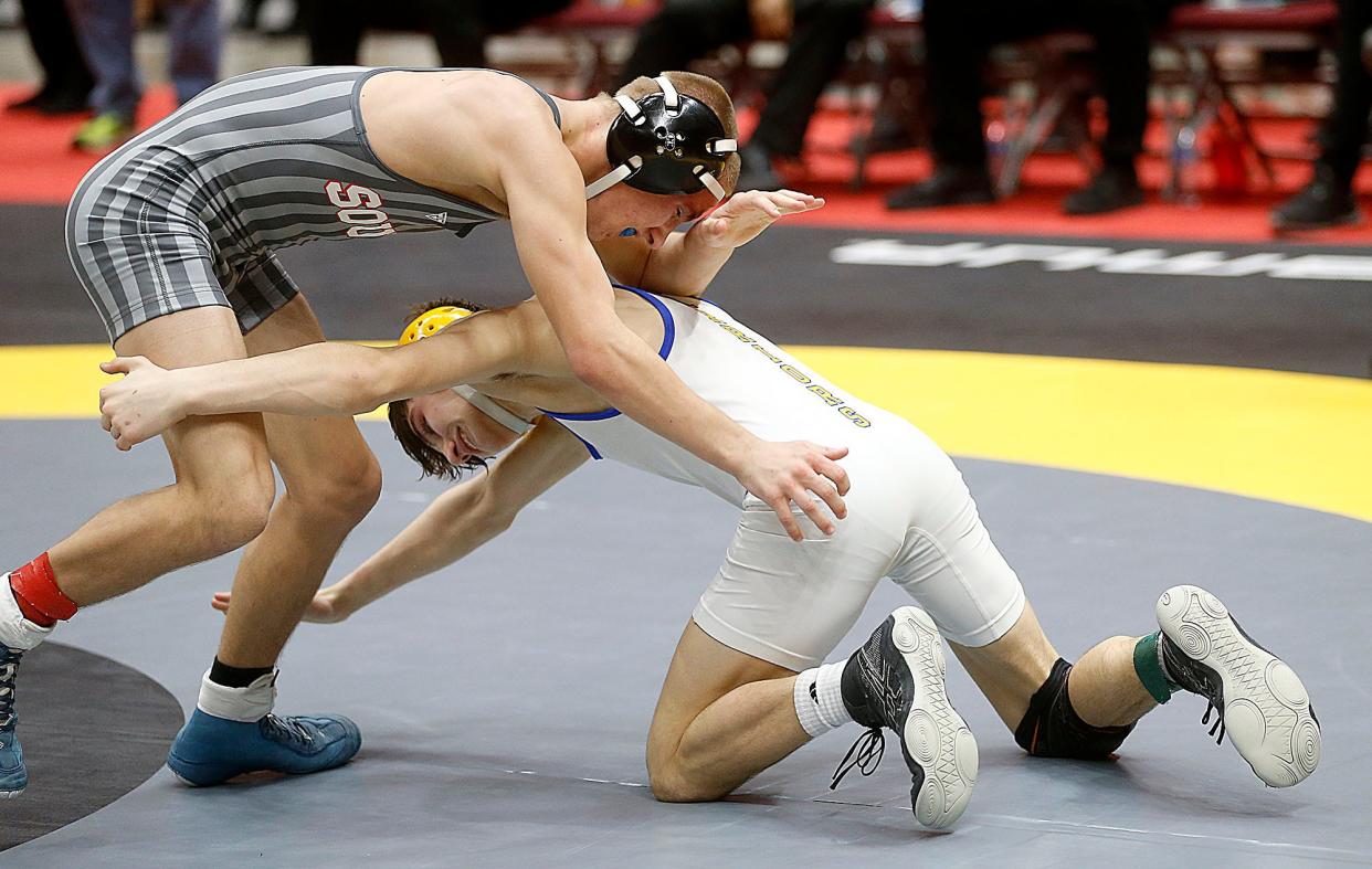 Ontario's Aiden Ohl wrestles Canton South's Dom Prosperi in a match at 106 pounds at the OHSAA State Wrestling Championships on March 10, 2023, in Columbus.