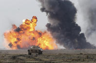 This photo released Tuesday, Jan. 19, 2021, by the Iranian Army, shows a military drill. Iran's military kicked off a ground forces drill on Tuesday along the coast of the Gulf of Oman, state TV reported, the latest in a series of snap exercises that the country is holding amid escalating tensions over its nuclear program and Washington's pressure campaign against Tehran. (Iranian Army via AP)