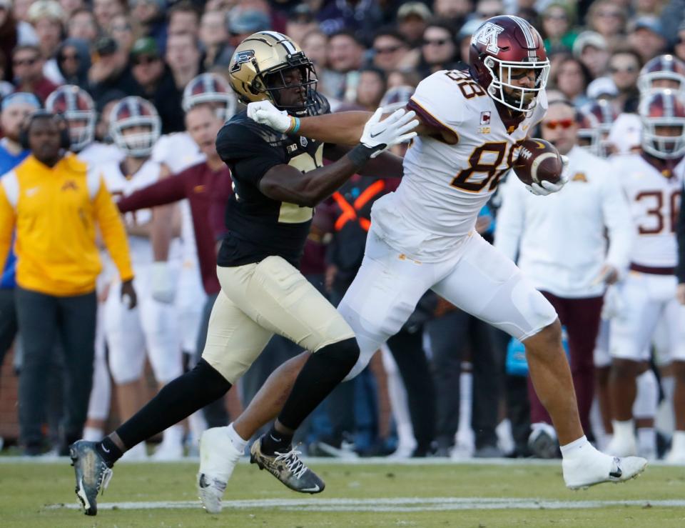 Minnesota Golden Gophers tight end Brevyn Spann-Ford (88) stiff-arms Purdue Boilermakers defensive back Sanoussi Kane (21) during the NCAA football game, Saturday, Nov. 11, 2023, at Ross-Ade Stadium in West Lafayette, Ind. Purdue Boilermakers won 49-30.