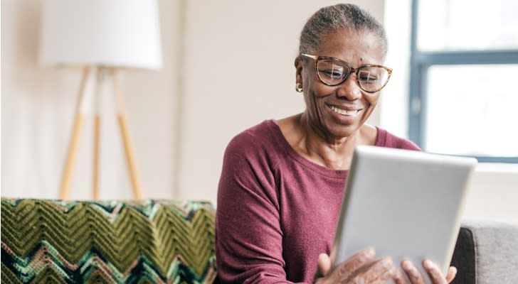 A 60-year-old woman preparing for retirement reviews her finances, including her monthly expenses. 