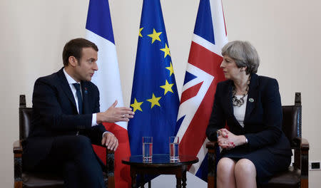 Britain's Prime Minister Theresa May and French President Emmanuel Macron talk during a bilateral meeting at the G7 Summit in Taormina, Sicily, Italy, May 26, 2017. REUTERS/Stephane De Sakutin/Pool