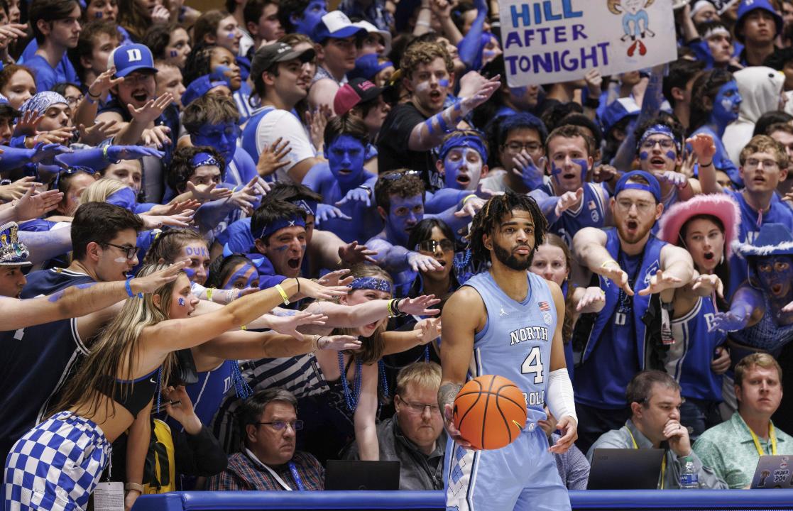 North Carolina's RJ Davis (4) in-bounds the ball in front of the Duke student section during the second half of an NCAA college basketball game in Durham, N.C., Saturday, March. 9, 2024. (AP Photo/Ben McKeown)