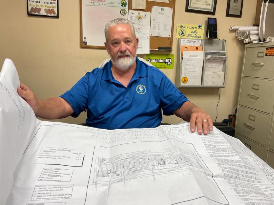 J.W. “Butch” Martin, public works director of Virginia Gardens, shows plans for a drainage project that secured $700,000 in state funding in the 2025 Florida budget passed by the Legislature in March but was vetoed by Gov. Ron DeSantis on June 12, 2024.