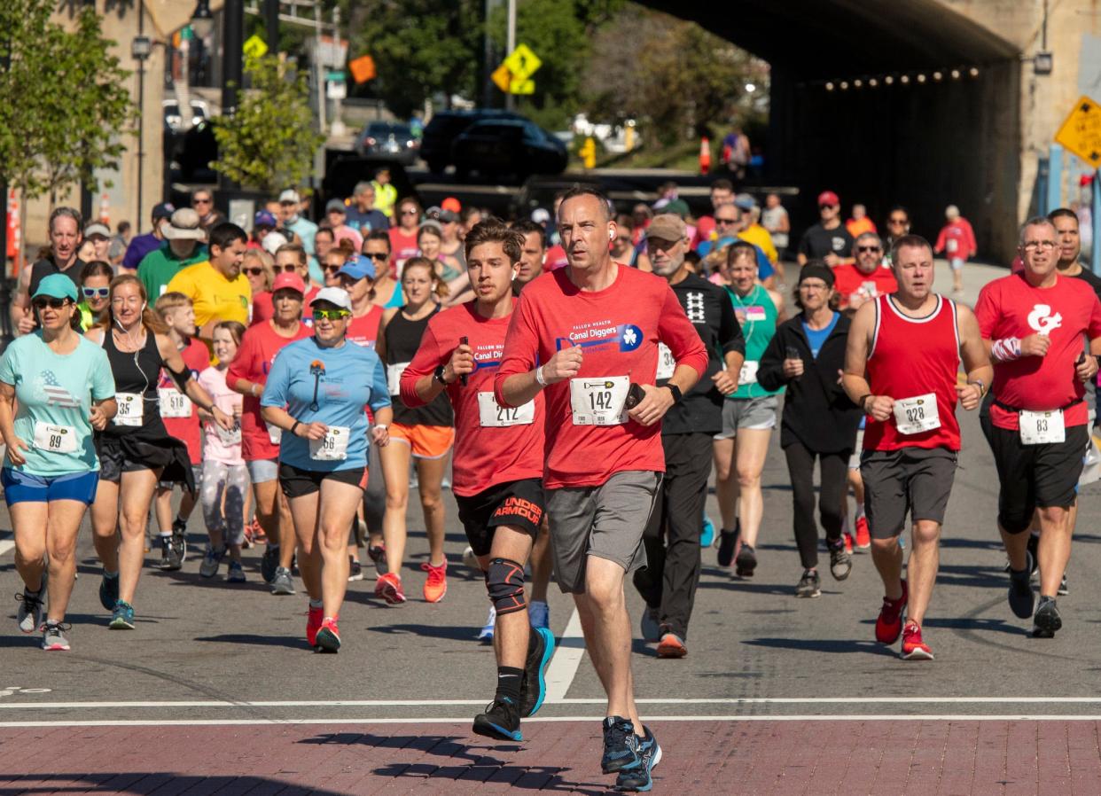 Canal Diggers 5K runners pass Polar Park on Madison Street last year.