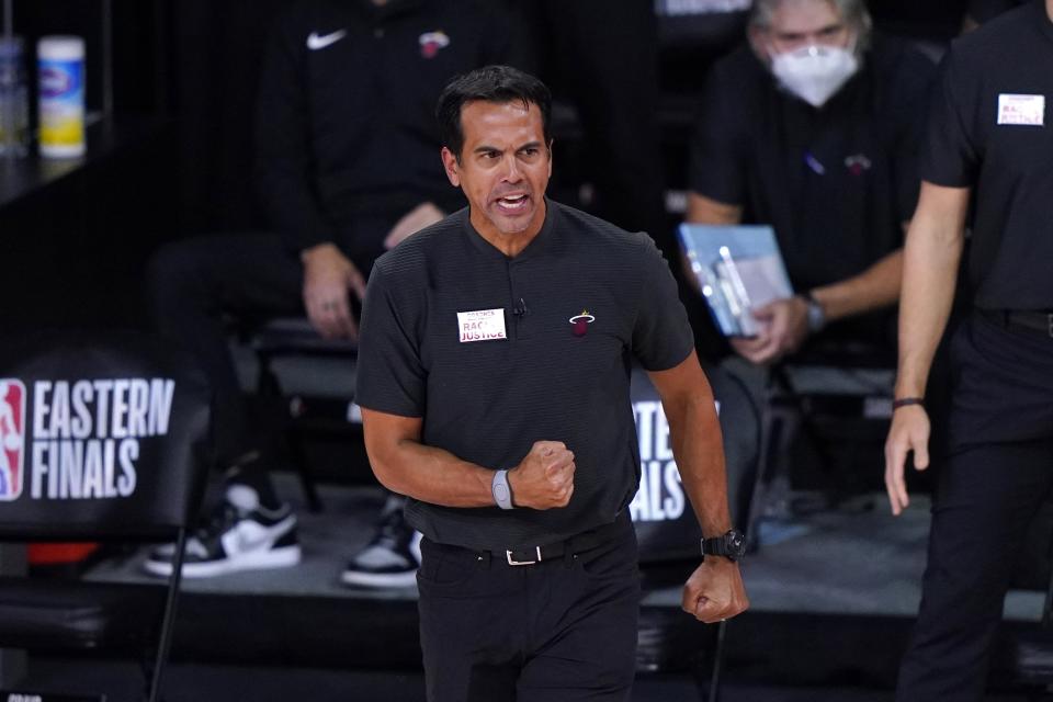 Miami Heat head coach Erik Spoelstra gestures as he watches play against the Boston Celtics during the second half of an NBA conference final playoff basketball game, Thursday, Sept. 17, 2020, in Lake Buena Vista, Fla. (AP Photo/Mark J. Terrill)