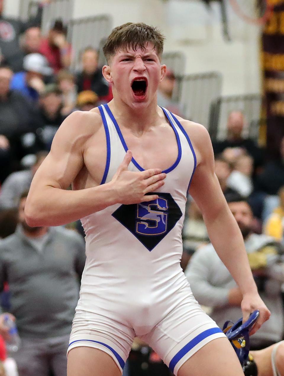 Cael Hughes of Stillwater celebrates his win after his 132-pound championship match in the Ironman wrestling tournament at Walsh Jesuit High School, Saturday, Dec. 10, 2022.