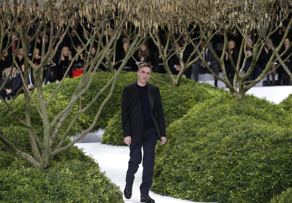 Belgian fashion designer Raf Simons thanks the audience after the presentation of Christian Dior's Spring Summer 2013 Haute Couture fashion collection, presented in Paris, Monday, Jan.21, 2013. (AP Photo/Christophe Ena)